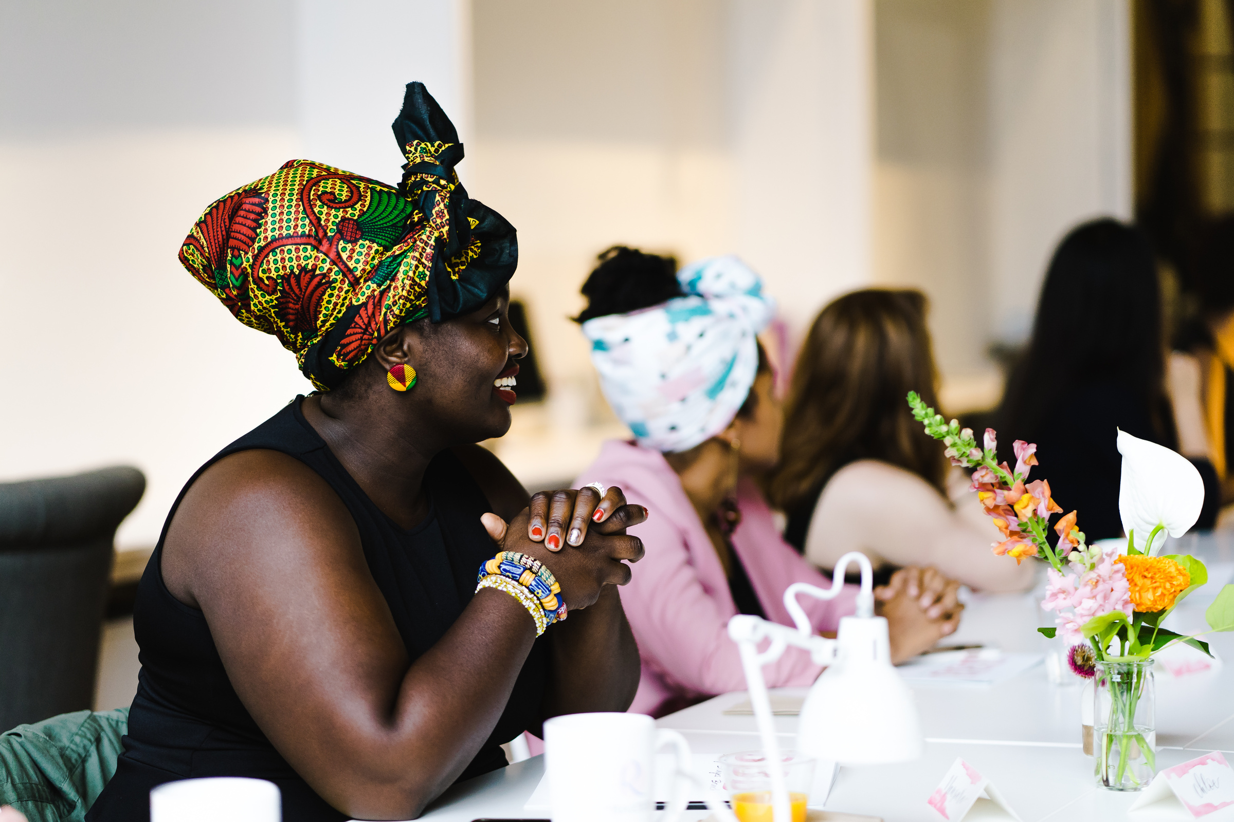 african woman smiling in headwrap